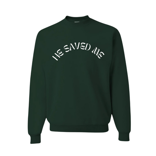 Forest Green premium crew neck sweatshirt. This sweatshirt reads "He Saved Me'" on the front in white letters. The fit is comfy and thick. From Crown of Favor Forrest Green He saved me sweatshirt crewneck. He Saved Me sweatshirt. Christian clothing brand.