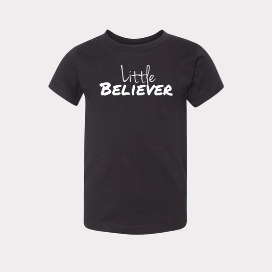 This Tshirt is all black with a crew neck style. The words Believer are pressed on the shirt in bold white letters. The T-Shirt is written across the chest, stretching from sholder to shoulder. The Tshirt this comftorable and fitted. Size up for an oversized look. On a Nuetral Colored back ground. The back reads John 3:16 on the tail of the T-Shirt.