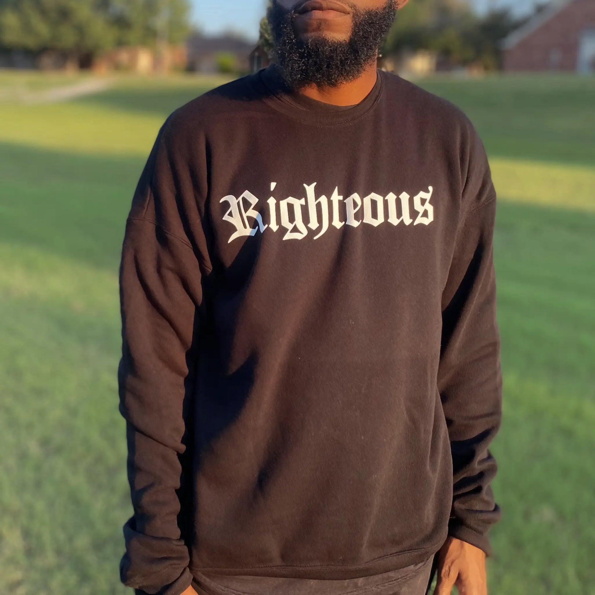 Black crew neck sweatshirt. Righteous written in bold white letters on the front of the black sweatshirt. Black sweatshirt, christian clothing, faith based apparel Righteous sweatshirt. Jesus inspired clothing. Oversized sweatshirt. loungewear. streetwear. Christian streetwear. Christian clothing brand