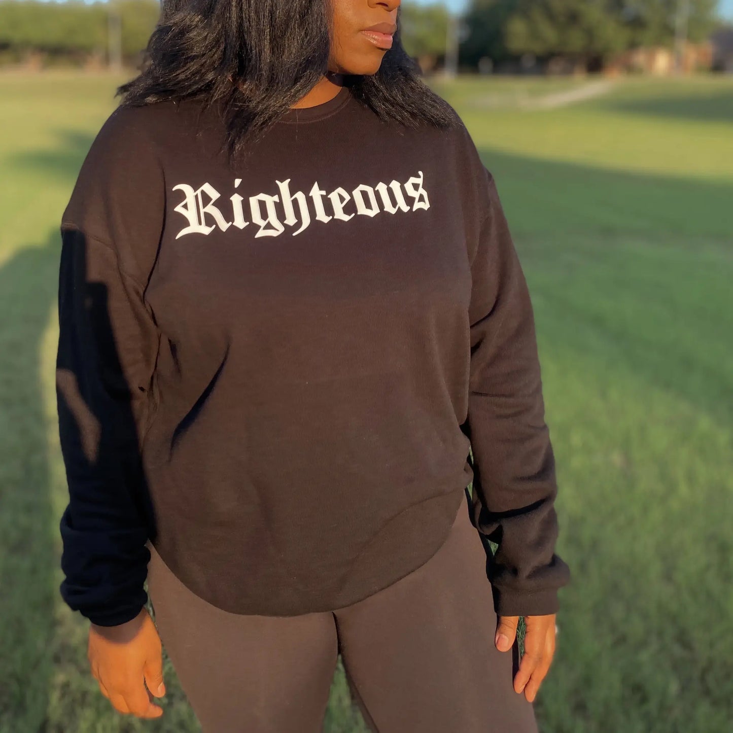 Black crew neck sweatshirt. Righteous written in bold white letters on the front of the black sweatshirt. Black sweatshirt, christian clothing, faith based apparel Righteous sweatshirt. Jesus inspired clothing. Oversized sweatshirt. loungewear. streetwear. Christian streetwear. Christian Clothing band