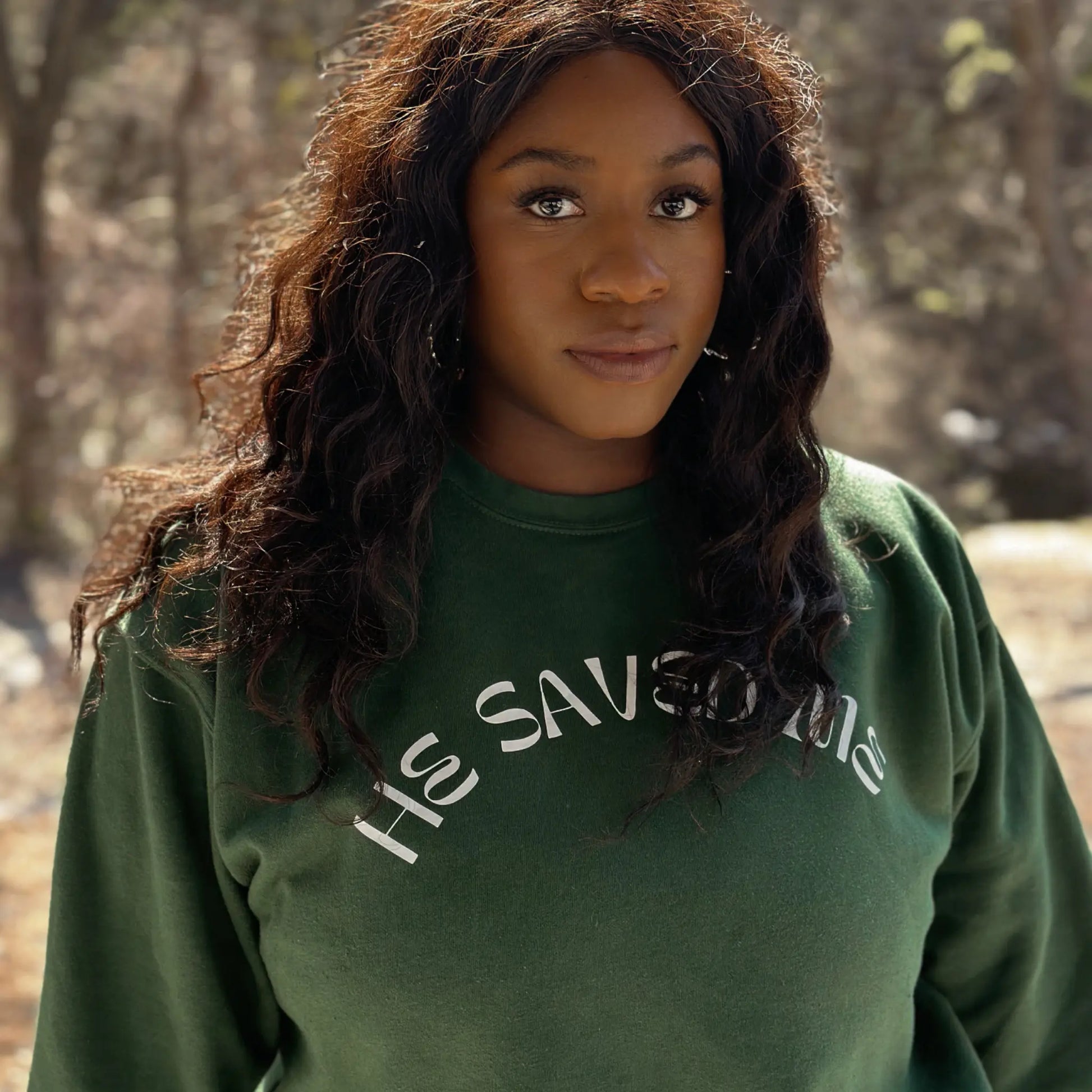 Forest Green premium crew neck sweatshirt. This sweatshirt reads "He Saved Me'" on the front in white letters. The fit is comfy and thick. From Crown of Favor Forrest Green He saved me sweatshirt crewneck. He Saved Me sweatshirt. Christian clothing brand  