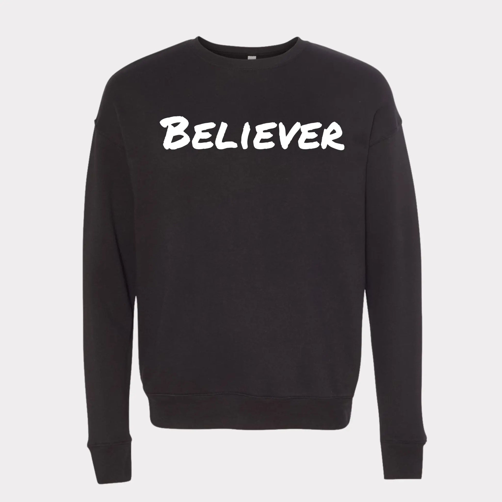 This Sweeatshirt is all black with a crew neck style. The words Believer are pressed on the shirt in bold white letters. Believer is written across the chest, stretching from sholder to shoulder. The sweatshirt this comftorable and fitted. Size up for an oversized look. Edit alt text. On a Nuetral Colored back ground. The back reads John 3:16 on the tail of the sweatshirt. 