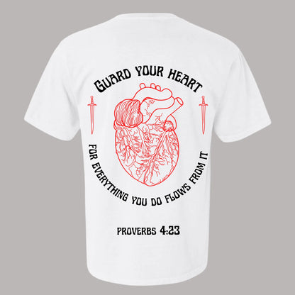 Guard your heart Tshirt. Red Heart T-shirt with swords on it and the verse Proverbs 4:23. Proverbs 4:23 Tshirt. Proverbs 4:23 Tshirt. Proverbs 4:23 black t-shirt from Crown of Favor. Crown of Favor guard your heart. For everything you do flows from it.. Christian clothing brand